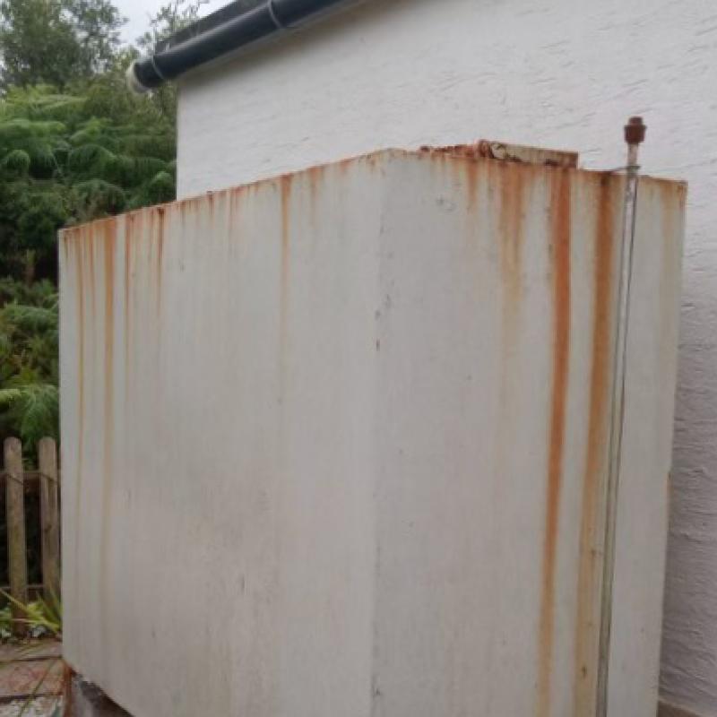 old domestic oil tank with rust damage
